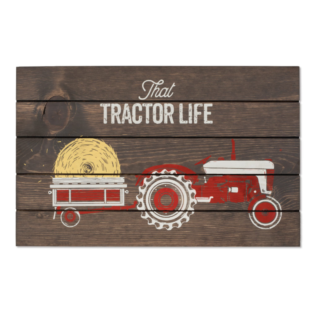 vintage tractor with trailer and hay roll bale